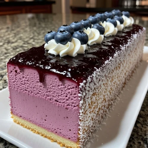 Blueberry Mousse Cheesecake Loaf with Coconut Crust and Blueberry Glaze